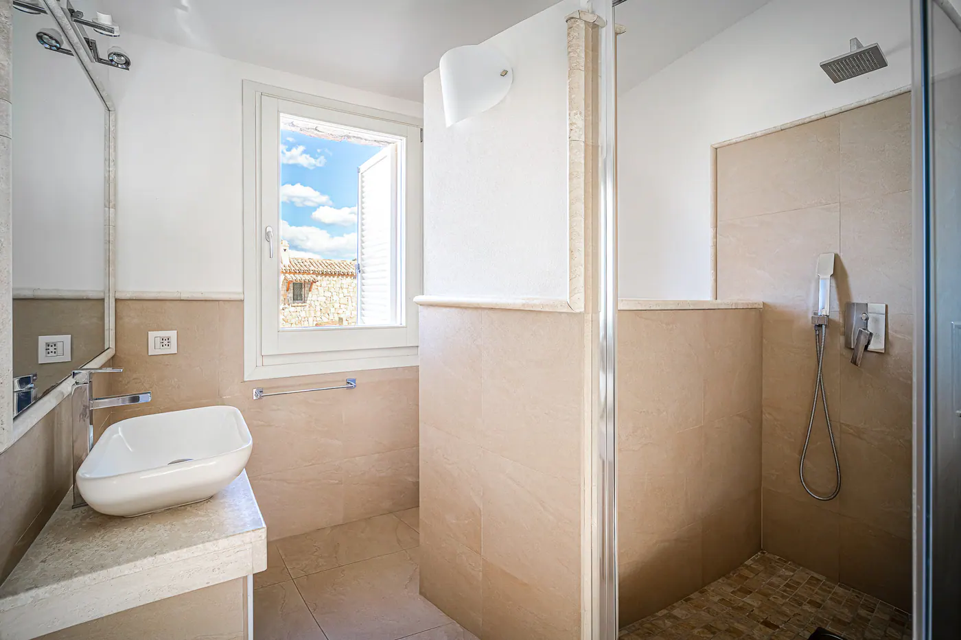 Bathroom with shower and countertop basin