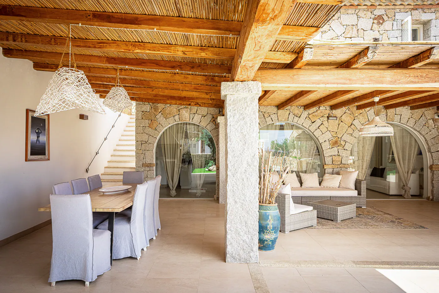 The long patio table with upholstered chairs